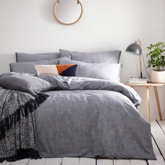 bed with grey duvet cover & pillows 