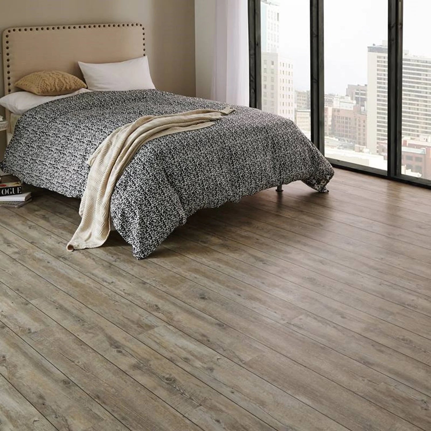 lamainte on floor in a bedroom with a bed 